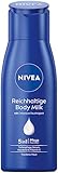 NIVEA Reichhaltige Body Milk Mini (75 ml), intensiv pflegende Körpercreme mit Mandelöl natürlichen Ursprungs, Lotion mit Tiefenpflege Serum und Vitamin E für 48h Feuchtigkeit