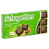 Schogetten Edel-Alpenvollmilch-Haselnuss 100g Schokoladentafel, praktisch einzeln portioniert. Ein Genuss. Stück für Stück.
