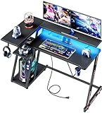 Korfile Computer-Gaming-Schreibtisch mit Steckdose und LED-Lichtern, L-förmiger Gamer-Tisch mit Ablagen für Schlafzimmer, wendbarer Eck-Heimbüro-Schreibtisch, 119 cm, Karbonfaser, Schwarz